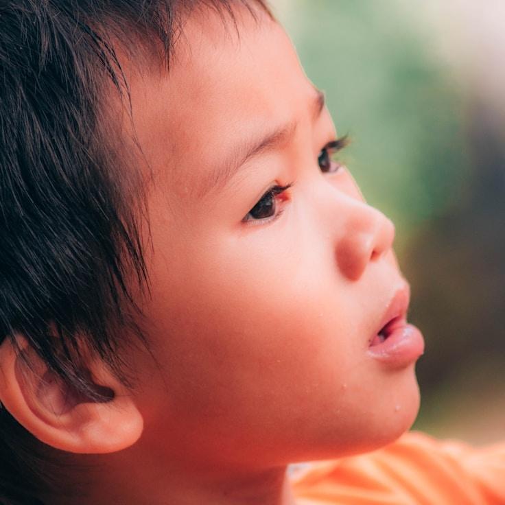 Avery Chen, Lead Design Curator at StellaNovaFlux, reviewing corporate floral arrangements